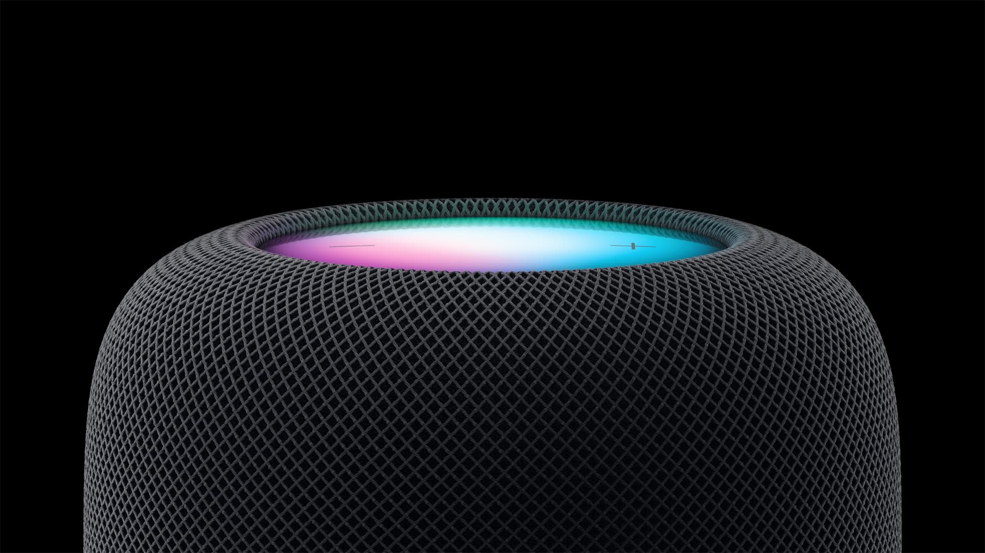 Close-up of Apple's HomePod smart speaker with its illuminated top surface
