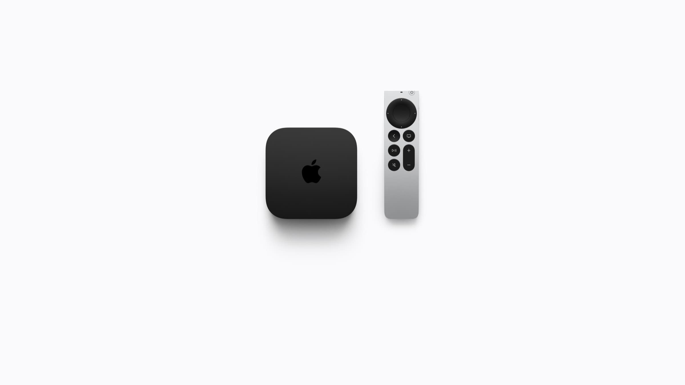 The new black Apple TV 4K box beside the complete silver Siri Remote on a white background