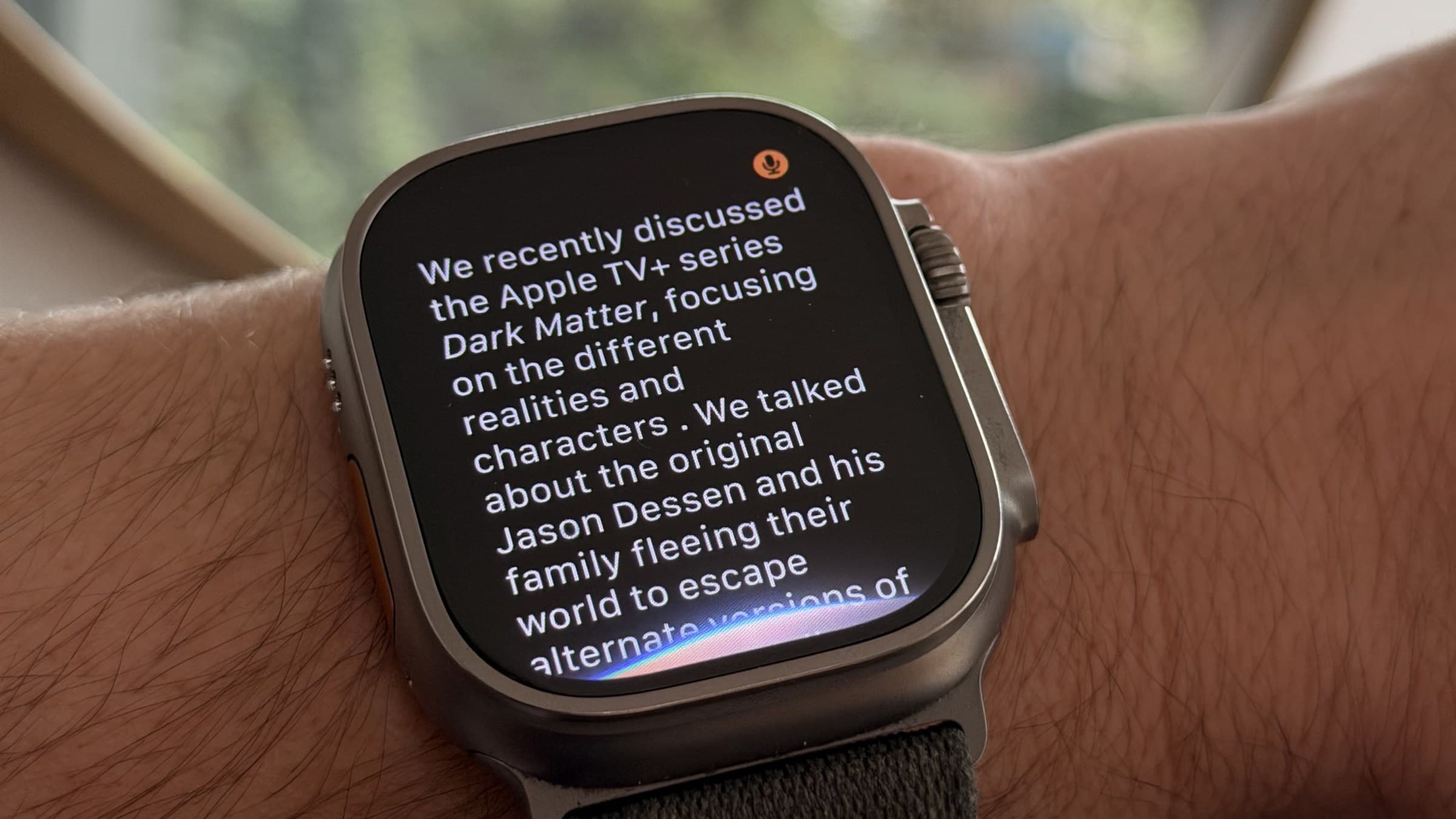 Apple Watch Ultra 3 on a wrist showing Siri recalling an earlier conversation about the series Dark Matter