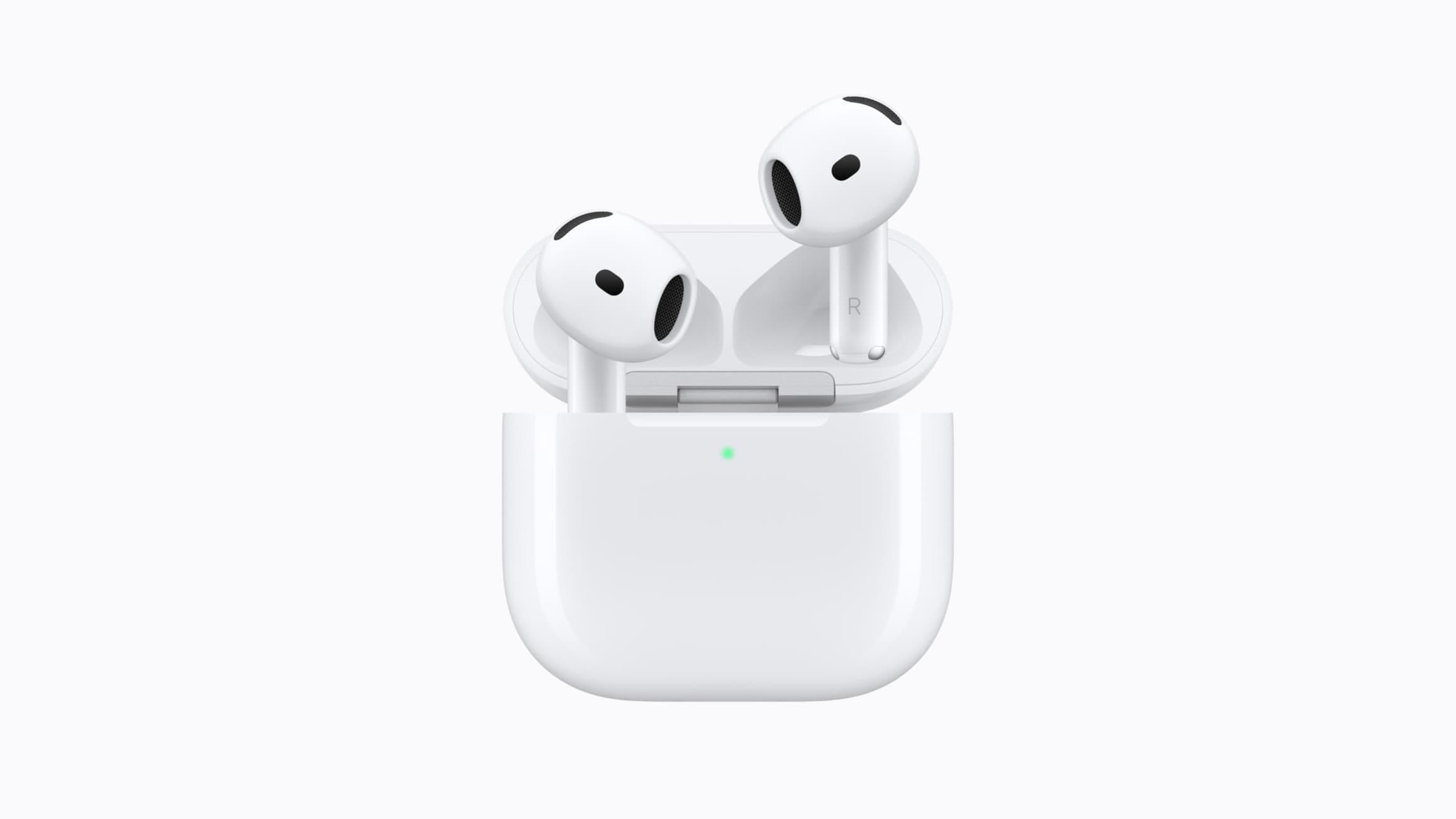 AirPods 5 earbuds above their open white wireless charging case