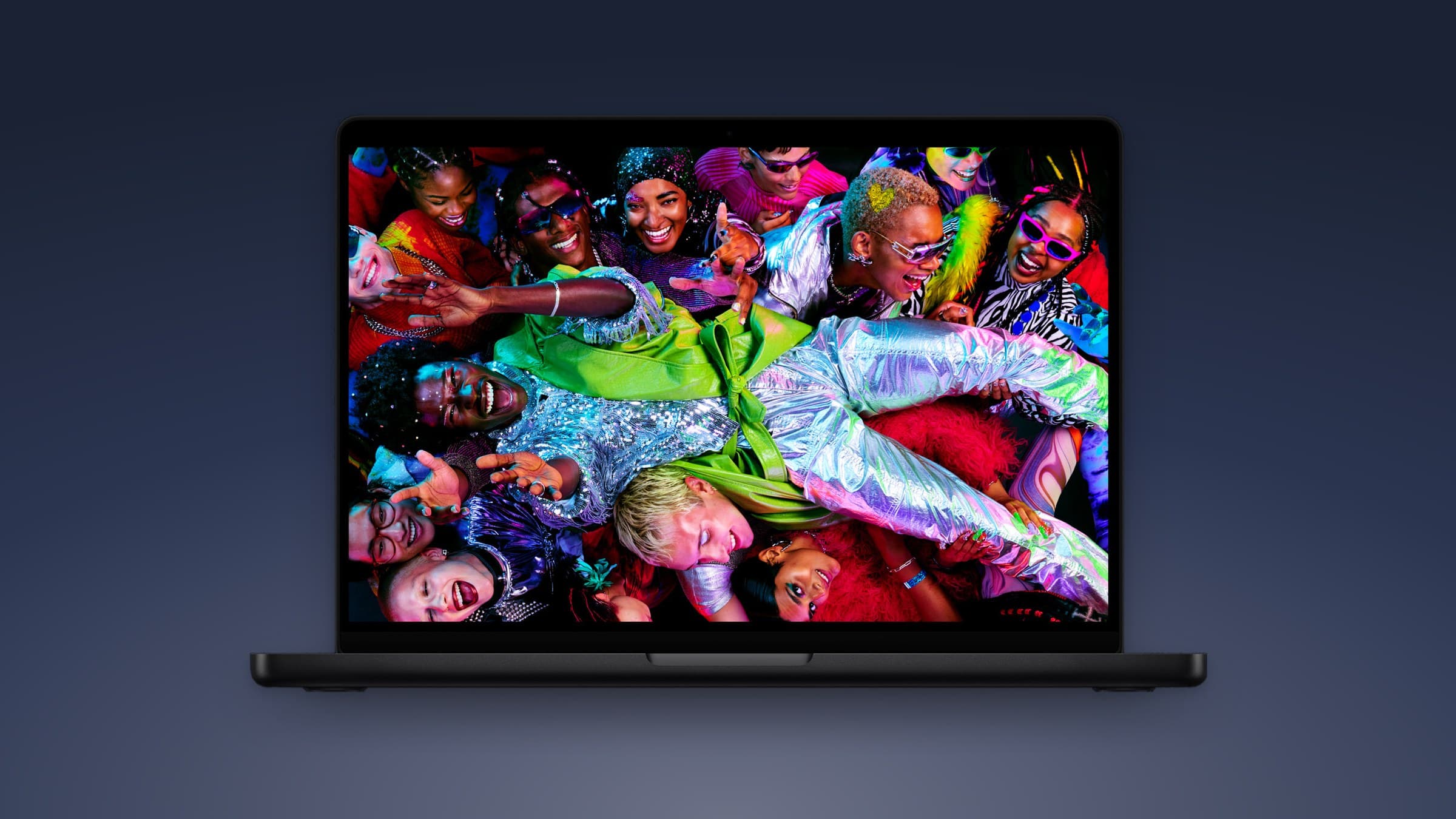 Current Apple MacBook Pro with Liquid Retina XDR display on a dark blue gradient background